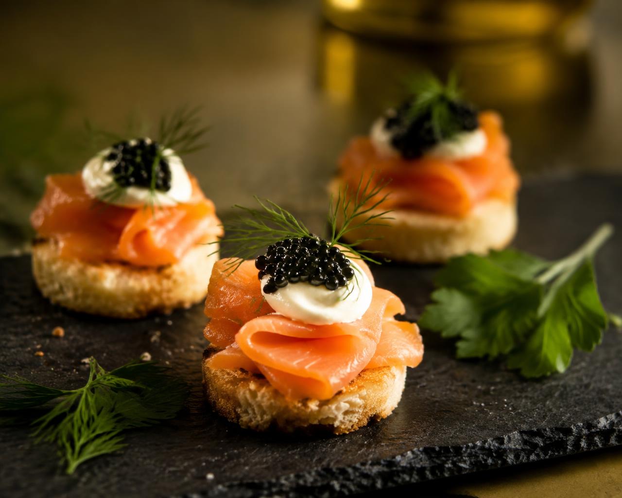 Canapés presented on a slate serving board